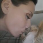 Diana Debreczeni kissing her bunny, a tender moment that captures love and calm